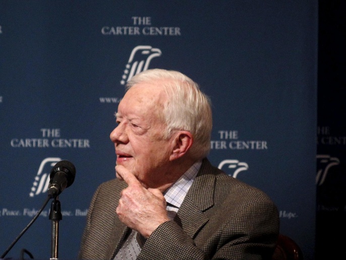 Former U.S. President Jimmy Carter listens as wife Rosalynn Carter (not pictured) speaks during "A Conversation with the Carters," during the annual public event at The Carter Center in Atlanta, Georgia September 15, 2015. REUTERS/Tami Chappell