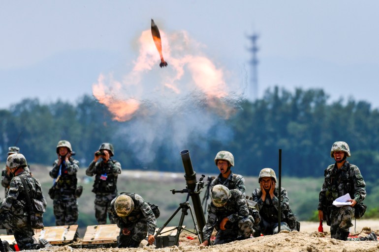 PLA soldiers fire a mortar during a live-fire military exercise in Anhui