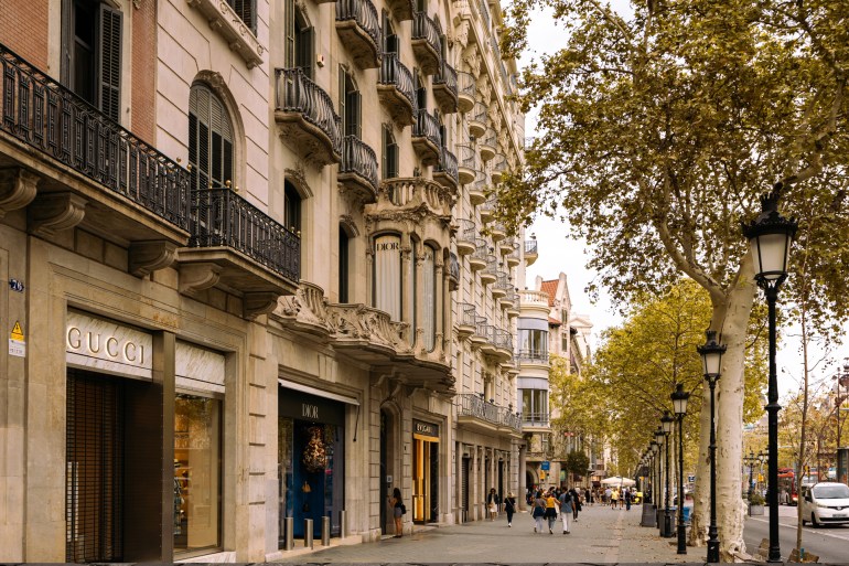 BARCELONA, SPAIN - SEPTEMBER 09, 2023: Passeig de Gracia - the most elegant boulevard of Barcelona with unique architecture and luxury stores شترستوك