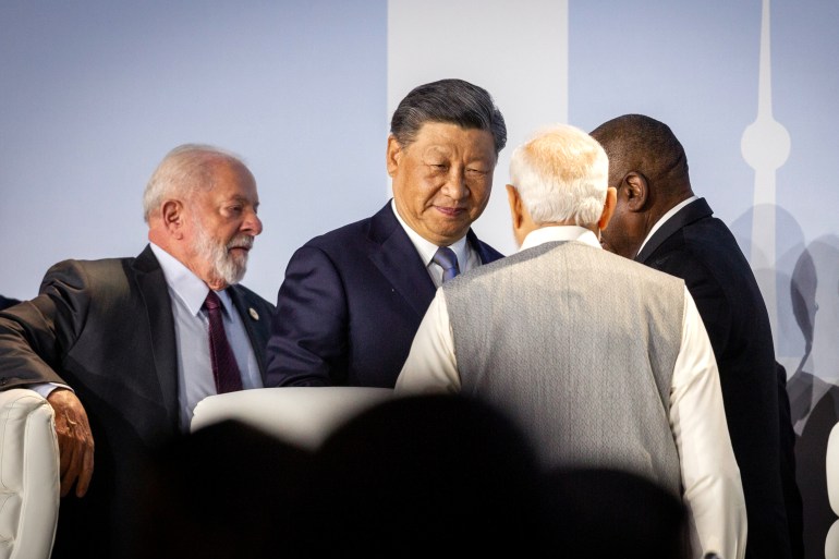 epa10817177 (L-R) Brazilian President Luiz Inacio Lula da Silva, Chinese President Xi Jinping, Indian Prime Minister Narendra Modi and South African President Cyril Ramaphosa speak as they attend the Friends of BRICS Leaders dialogue during the 15th BRICS Summit, in Johannesburg, South Africa, 24 August 2023. South Africa is hosting the 15th BRICS Summit, (Brazil, Russia, India, China and South Africa), as the groups economies account for a quarter of global gross domestic product. EPA-EFE/YESHIEL PANCHIA