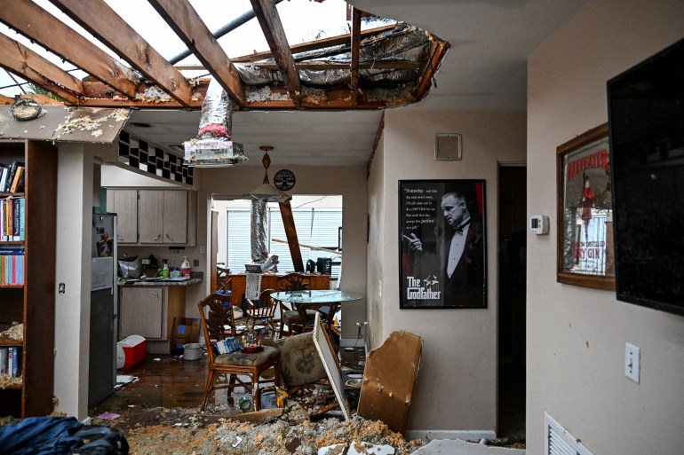 Connor Ferran's house is seen after it was hit by a tornado in Fort Myers, Florida on October 9, 2024, as Hurricane Milton approaches. - Milton reg سذained power on October 8 to become a Category 5 storm with maximum sustained winds of 165 mph (270 kph) as it barrels towards the west-central coast of Florida and is forecast to make landfall late October 9, according to the National Hurricane Center. (Photo by CHANDAN KHANNA / AFP)