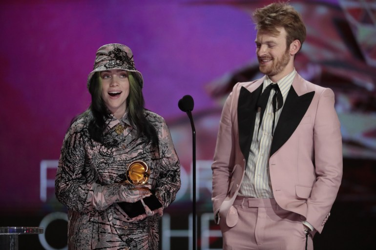 Los Angeles, CA, Sunday, March 14, 2021 - Billie Eilish and brother Finneas accepts the award for Album of the Year at the 63rd Grammy Award outside Staples Center. (Robert Gauthier/Los Angeles Times via Getty Images)