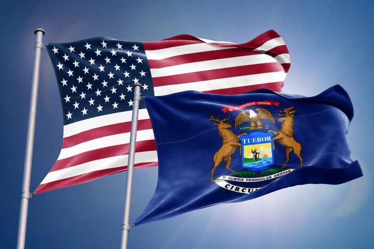 The flag of the state of Michigan is a coat of arms set on a dark blue field, as set forth by Michigan state law.swing states 2024; Shutterstock ID 2530474027; purchase_order: aljazeera ; job: ; client: ; other: