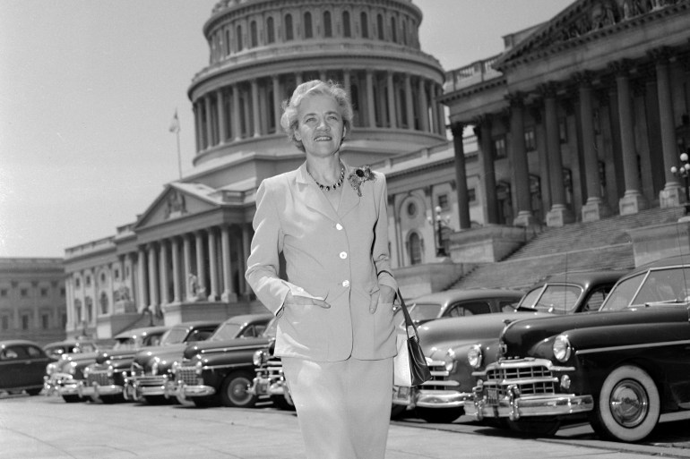 (Original Caption) Senator Margaret Chase Smith (R. Maine) shown strolling across the Capitol Plaza, has been named the Best Tailored Woman in Government by the Custom Tailors Guild of America. Another Washingtonian, Mrs. Gwendolyn Cafritz was named Best Tailored Hostess.