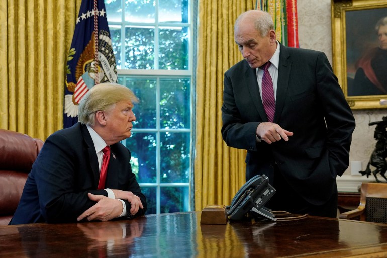 U.S. President Donald Trump speaks to White House Chief of Staff John Kelly after an event with reporters in the Oval Office at the White House in Washington, U.S. October 10, 2018. REUTERS/Jonathan Ernst TPX IMAGES OF THE DAY