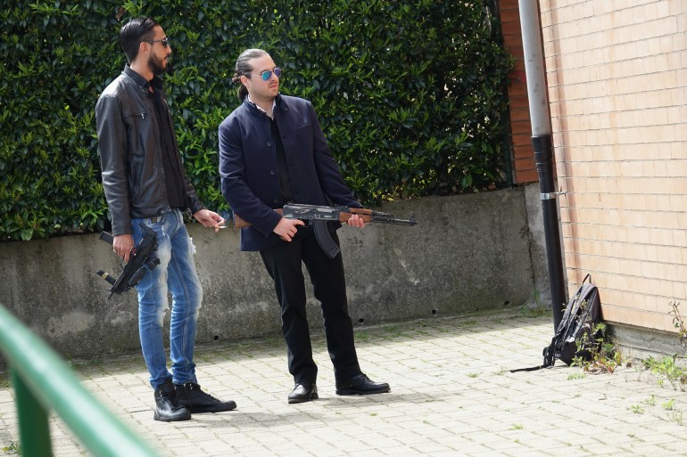 Gang members with a gun ready to shoot. Marseille, France - April 2018