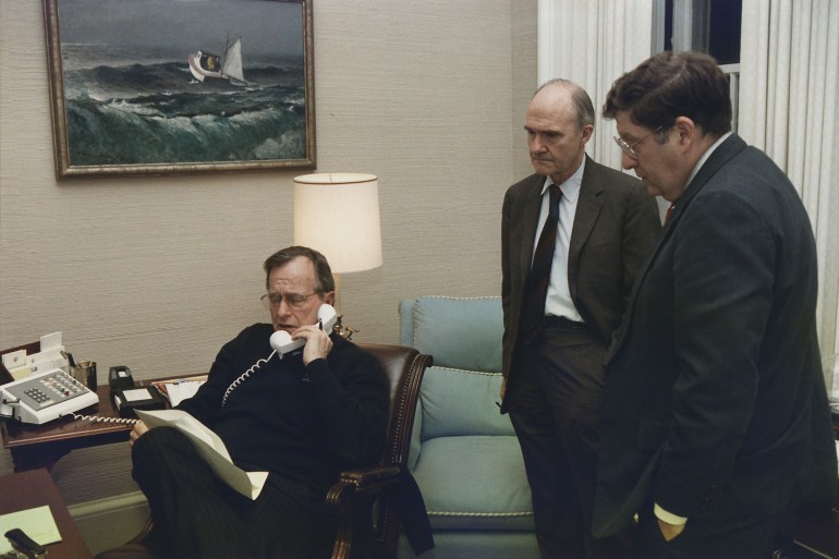 Mandatory Credit: Photo by Everett/Shutterstock (10290898a) President George Bush in a telephone conference regarding the Panama invasion on Dec. 20 1989. With him in the Oval Office Study are Gen. Brent Scowcroft and John Sununu. Historical Collection