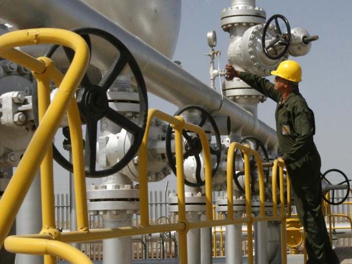 FILE- In this Tuesday, April 15, 2008 file photo, Iranian oil technician Majid Afshari checks the oil separator facilities in Azadegan oil field, near Ahvaz, Iran. When Iran welcomes leaders to a world gathering next week, few will get a grander reception than India's prime minister. As Tehran tries to offset the squeeze from Western oil sanctions, there is no greater priority than courting energy-hungry Asian markets. (AP Photo/Vahid Salemi, File)